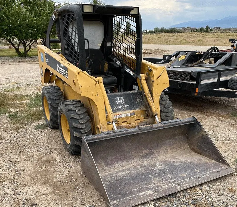 Weekend Warriors JD 320G skid steer with bucket.